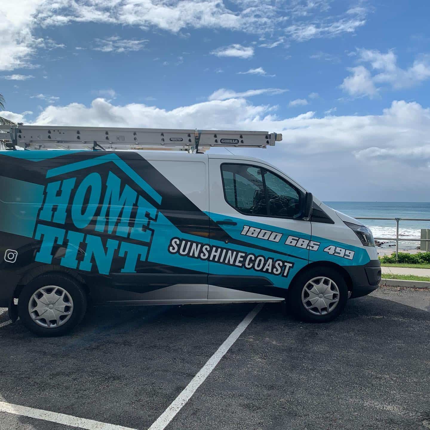 A Home Tint Van Is Parked In A Parking Lot — Home Tint Sunshine Coast Window Tinting In Maroochydore, QLD