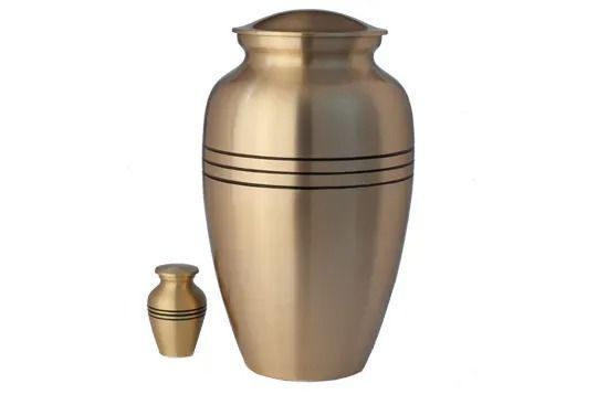 Brass funeral urn with a smaller matching keepsake urn beside it