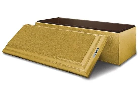Gold insulated mailing envelope with lid beside an open brown cardboard box