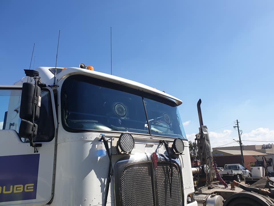 A White Truck Is Parked In A Parking Lot With A Blue Sky In The Background — Petrena Windscreens In Cecil Plains, QLD