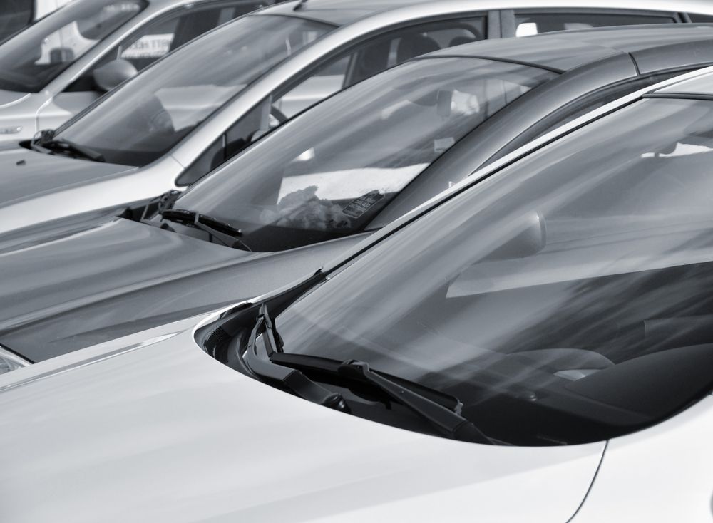 A Black And White Photo Of A Row Of Cars Parked Next To Each Other — Petrena Windscreens In Leyburn, QLD