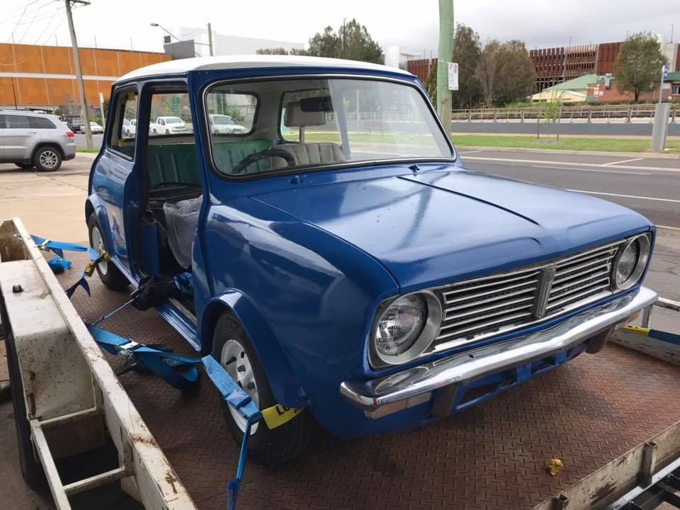 A Blue Car Is Sitting On Top Of A Trailer — Petrena Windscreens In Highfields, QLD