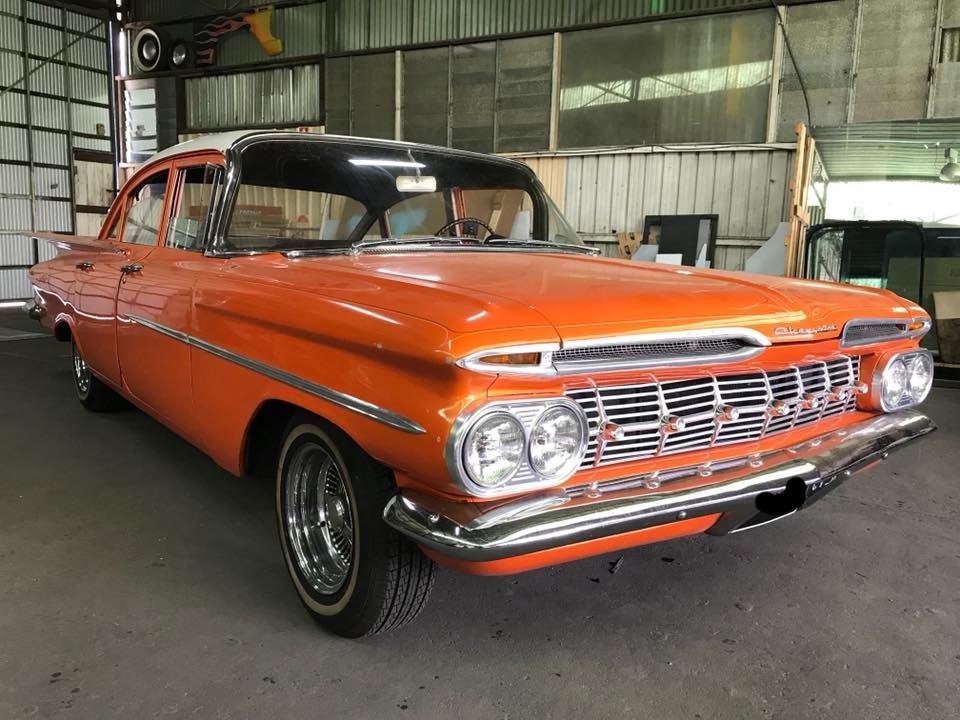 An Orange Chevrolet Impala Is Parked In A Garage — Petrena Windscreens In Allora, QLD