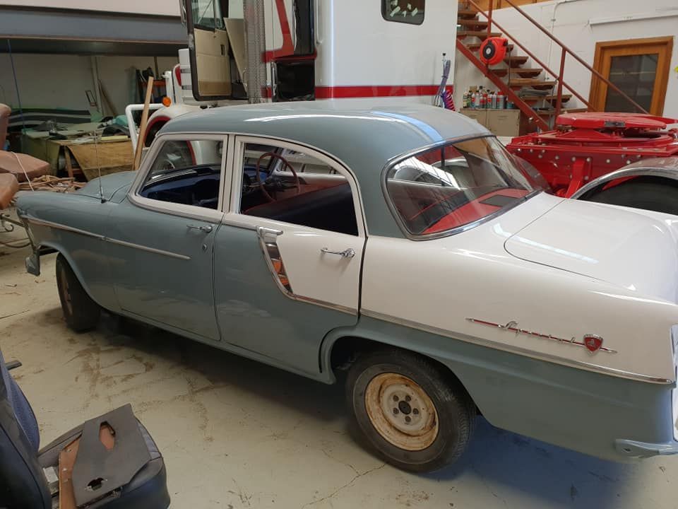 A Blue And White Car Is Parked In A Garage — Petrena Windscreens In Highfields, QLD