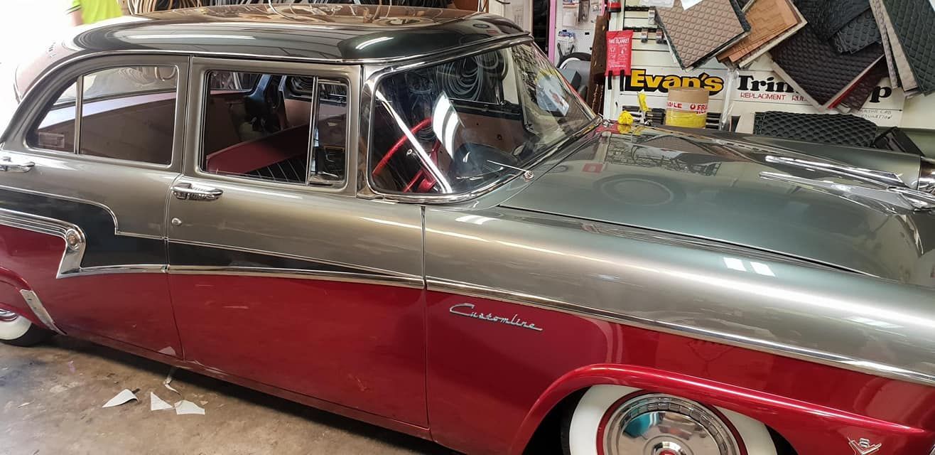 A Red And Silver Car Is Parked In A Garage — Petrena Windscreens In Toowoomba City, QLD