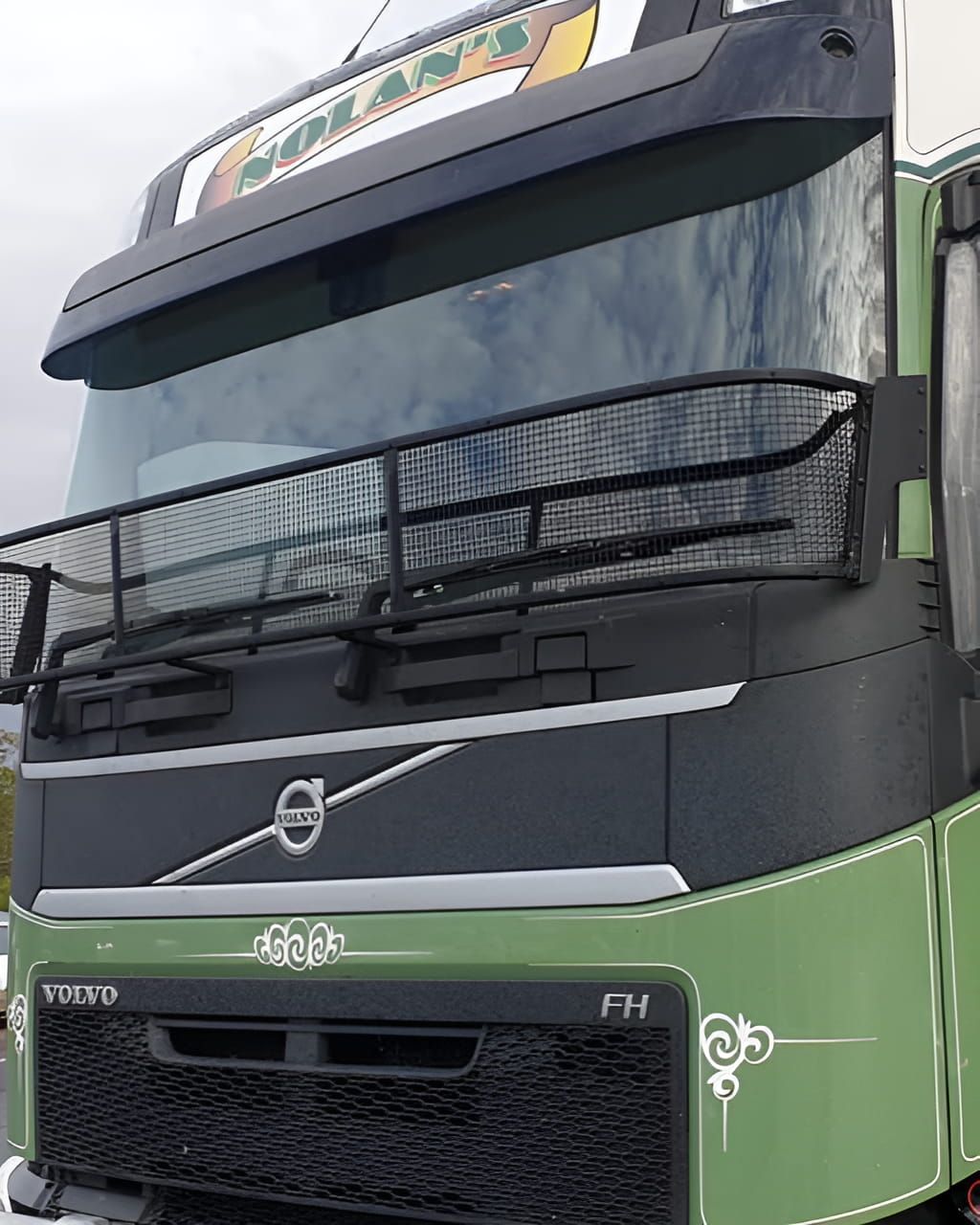 A Black And Green Volvo Truck Is Parked On The Side Of The Road — Petrena Windscreens In Toowoomba City, QLD