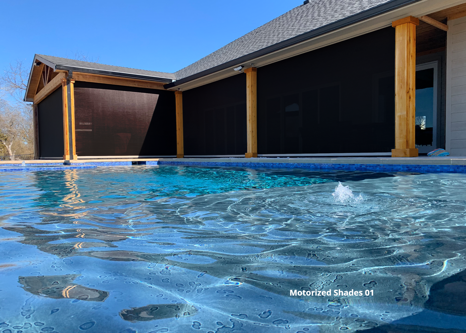 4 Motorized patio shades with a pool in the foreground