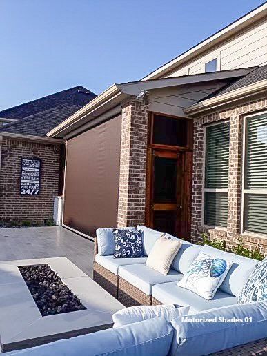 Retractable patio shades with a firepit and patio furniture 