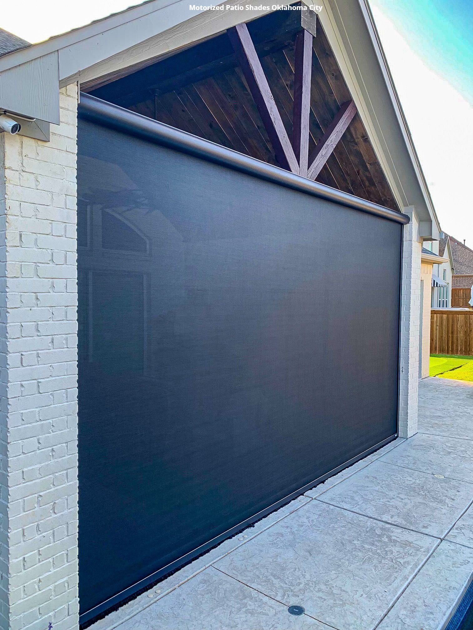 a white brick house with a black patio screen on the side Oklahoma City