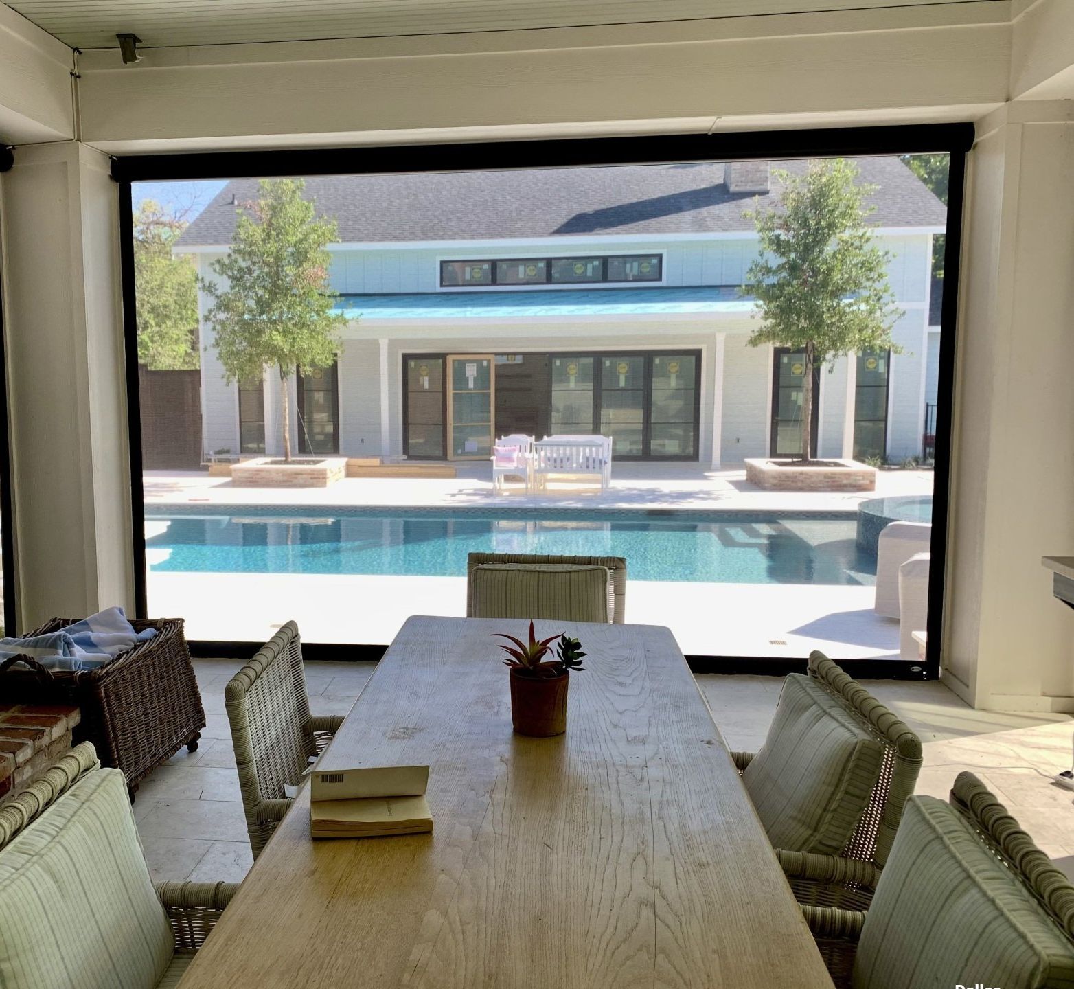 Backyard with retractable motorized patio screens