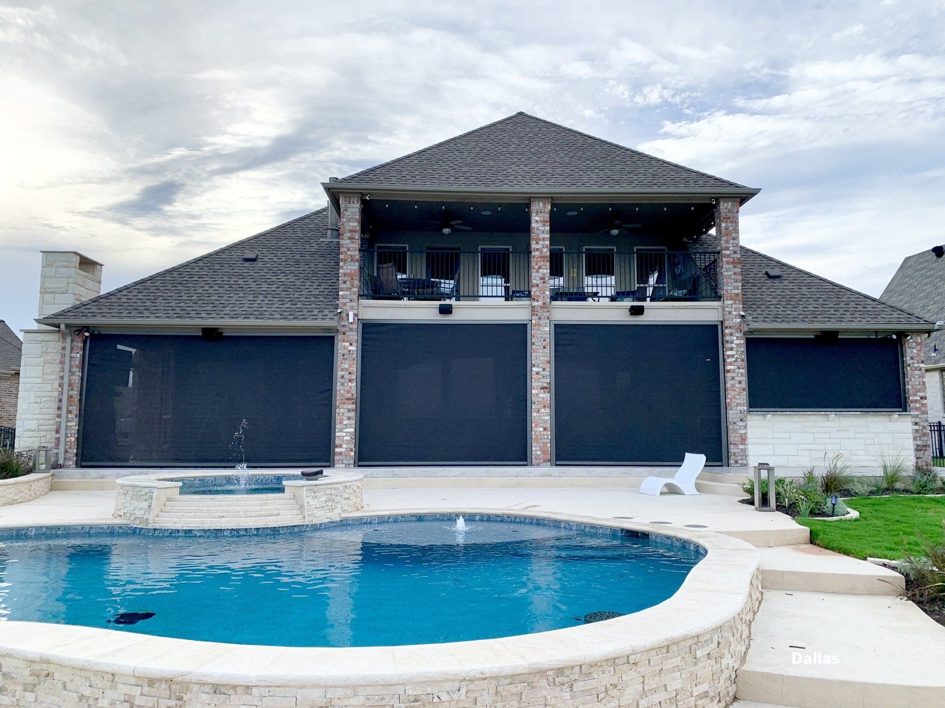 Retractable patio screen by a luxurious deck