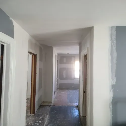 This image showcases a stunning gypsum plaster finish that we achieved during a Buffalo drywall renovation.