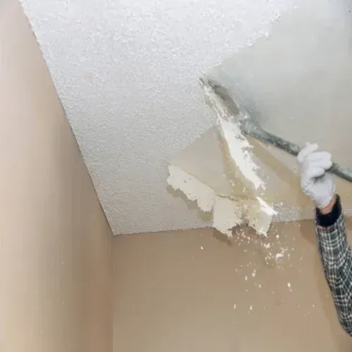 This photo showcases a successful popcorn ceiling removal project completed by our expert team at Drywall Repair Buffalo. Our professional drywall services, including popcorn ceiling removal, are designed to help homeowners in Buffalo, Cheektowaga, Sloan, and the surrounding areas update their homes with ease. The photo captures the transformation from an outdated popcorn ceiling to a smooth and modern surface, free of the hazards and drawbacks of popcorn ceilings. Say goodbye to dusty, hard-to-clean, and dated popcorn ceilings with our top-notch popcorn ceiling removal services. Trust Drywall Repair Buffalo for all your drywall needs, and enjoy the benefits of a beautiful and updated home.