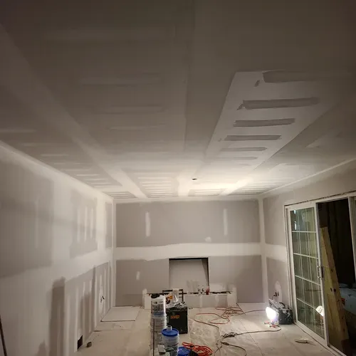 This picture features a smooth plasterboard finish that our team achieved during a drywall installation project in Buffalo.