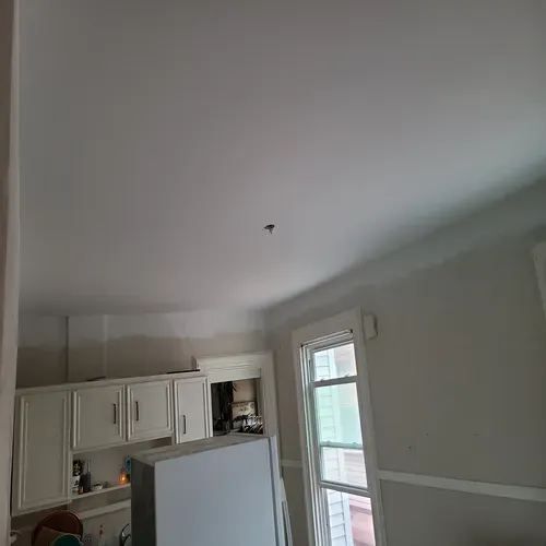 This picture highlights a drywall renovation project that enhanced the look of this Buffalo home.