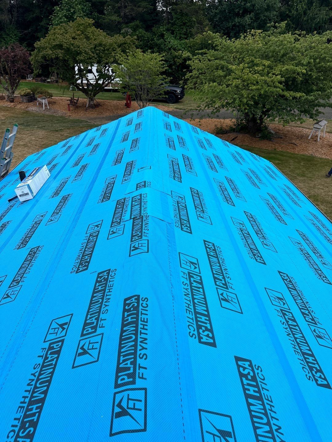 Roof repair experts restoring a damaged roof in Yelm after severe weather.