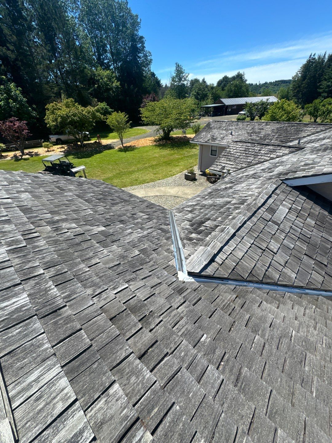 Roof repair experts restoring a damaged roof in Yelm after severe weather.