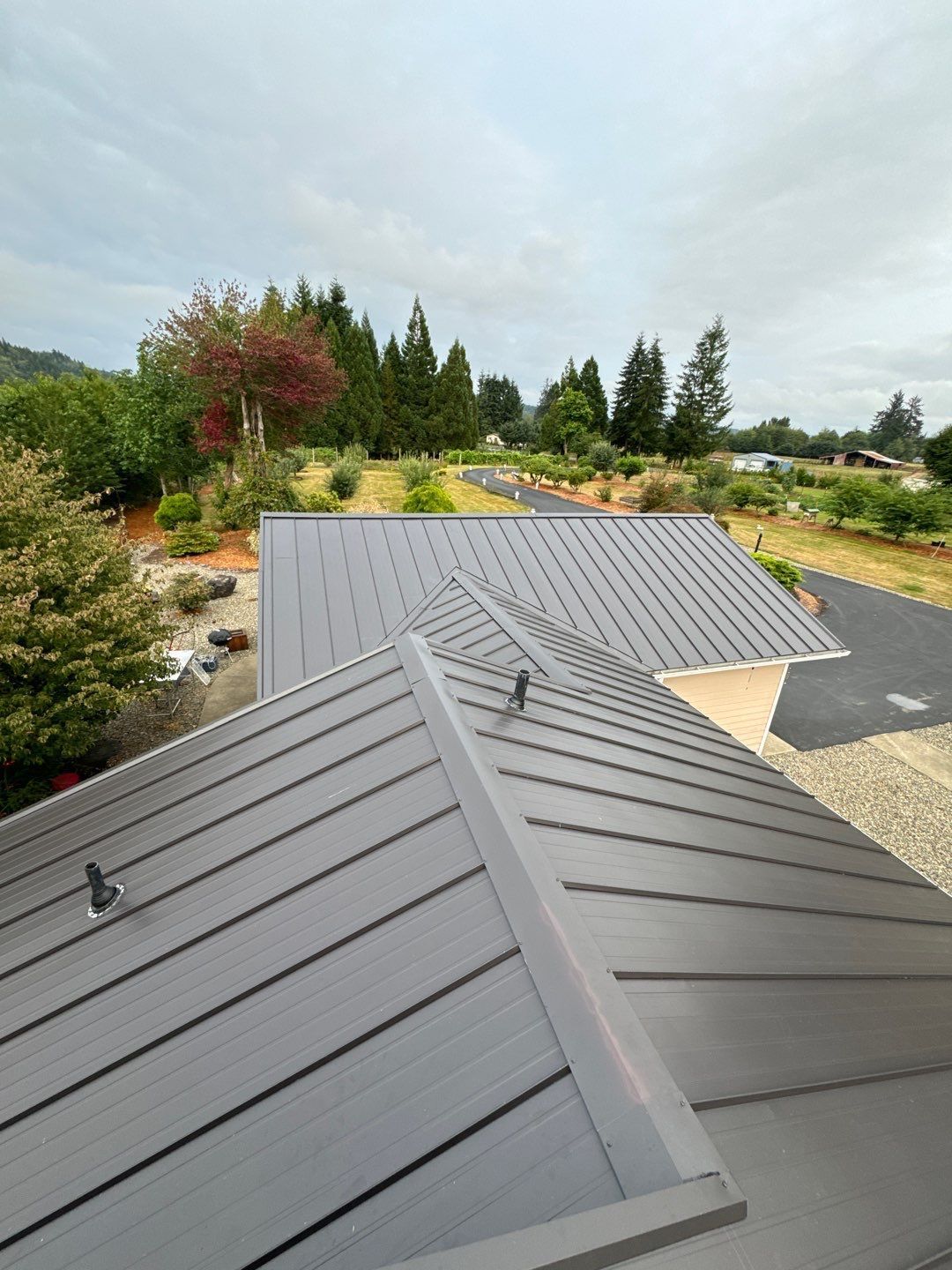 Roofing specialists replacing an aging roof on a home in Centralia, Washington.