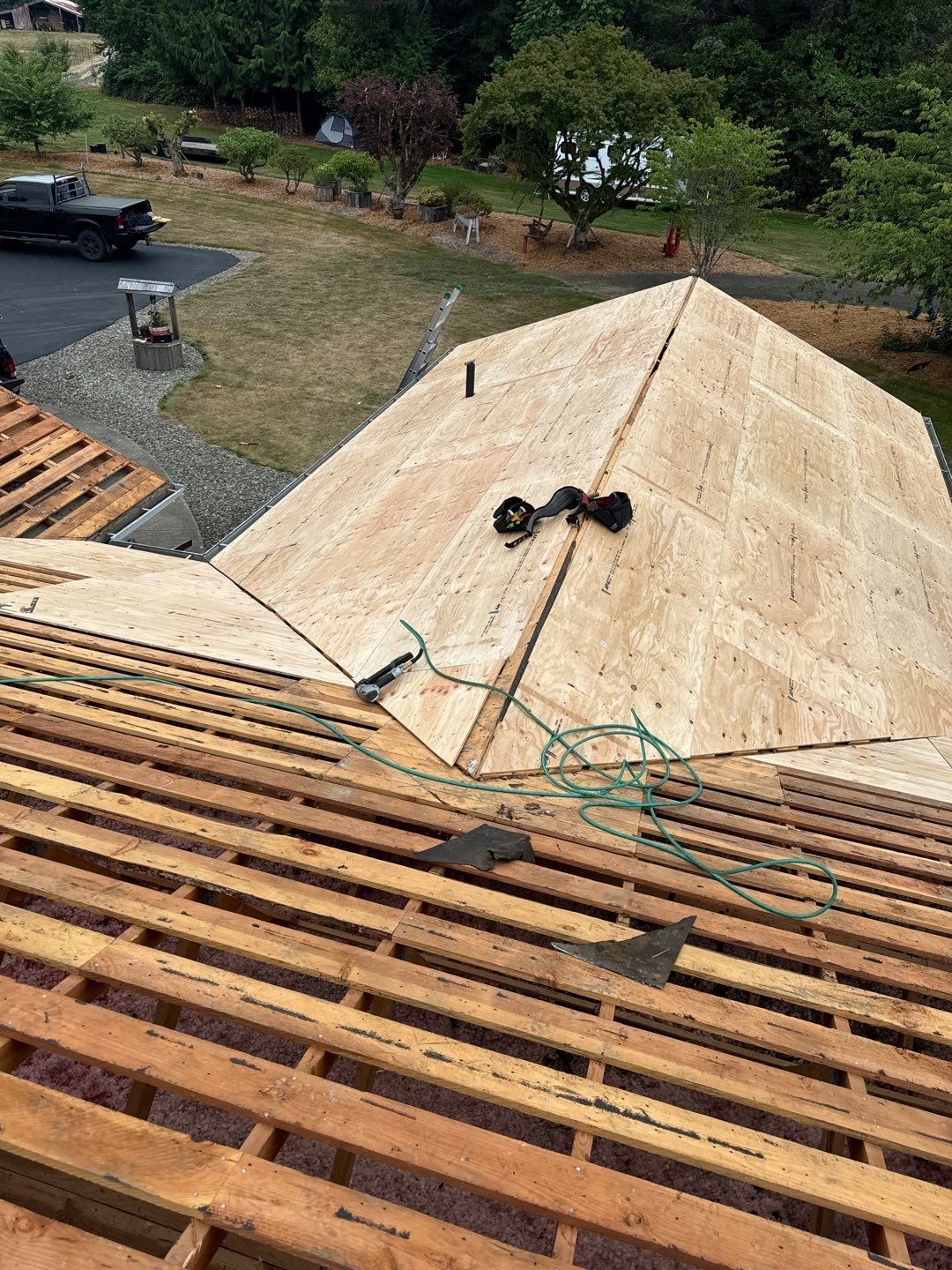 Roof repair experts restoring a damaged roof in Yelm after severe weather.