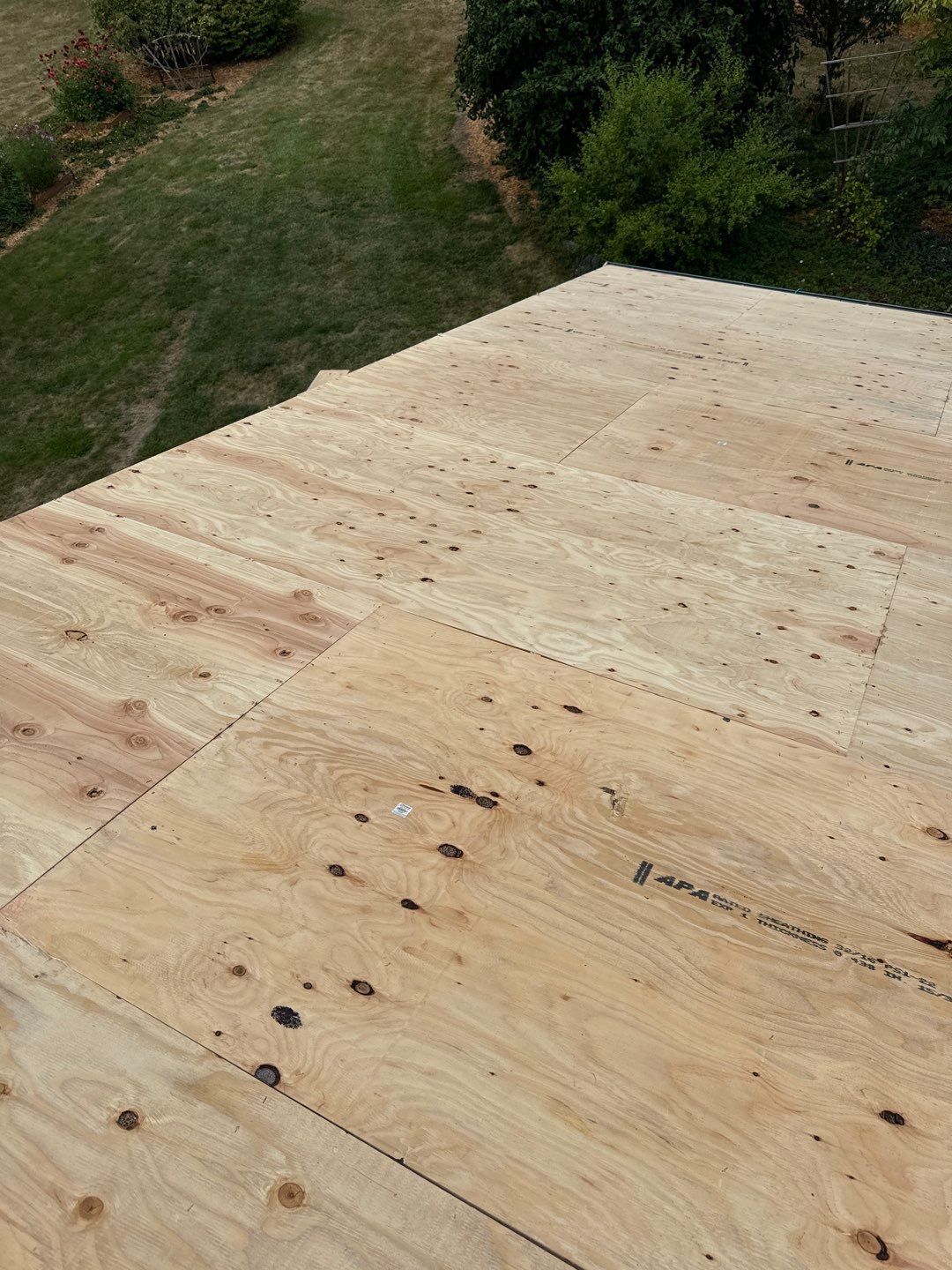 Roof repair experts restoring a damaged roof in Yelm after severe weather.