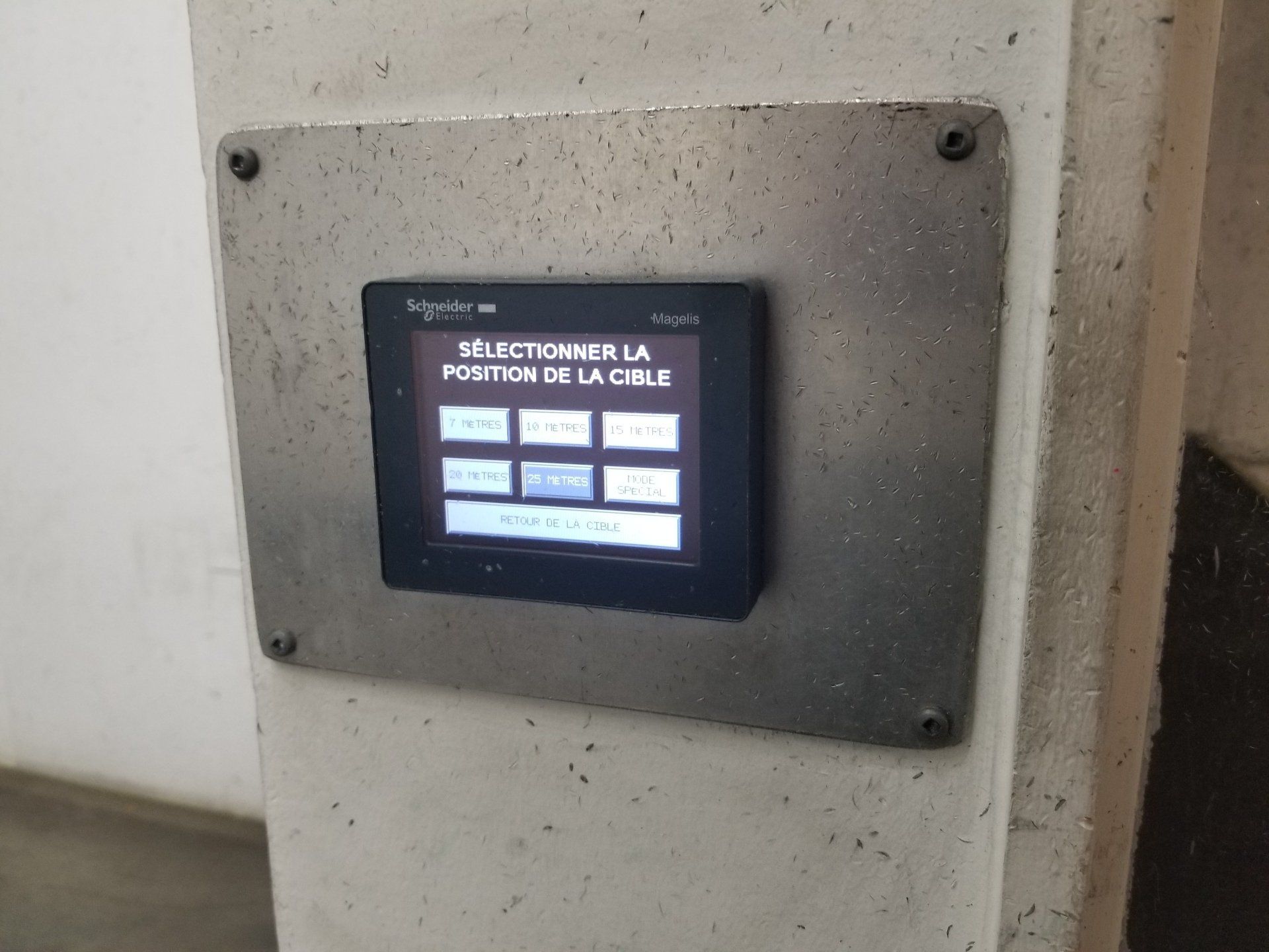 Touchscreen on a metal plate, text says 