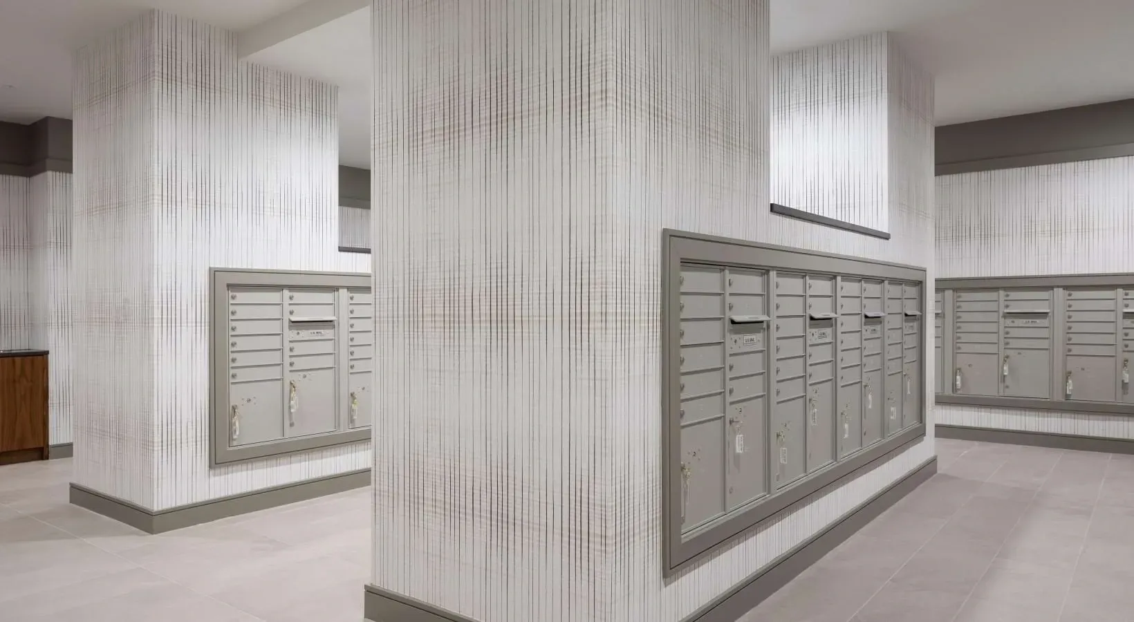 Mailboxes in a modern apartment building lobby.