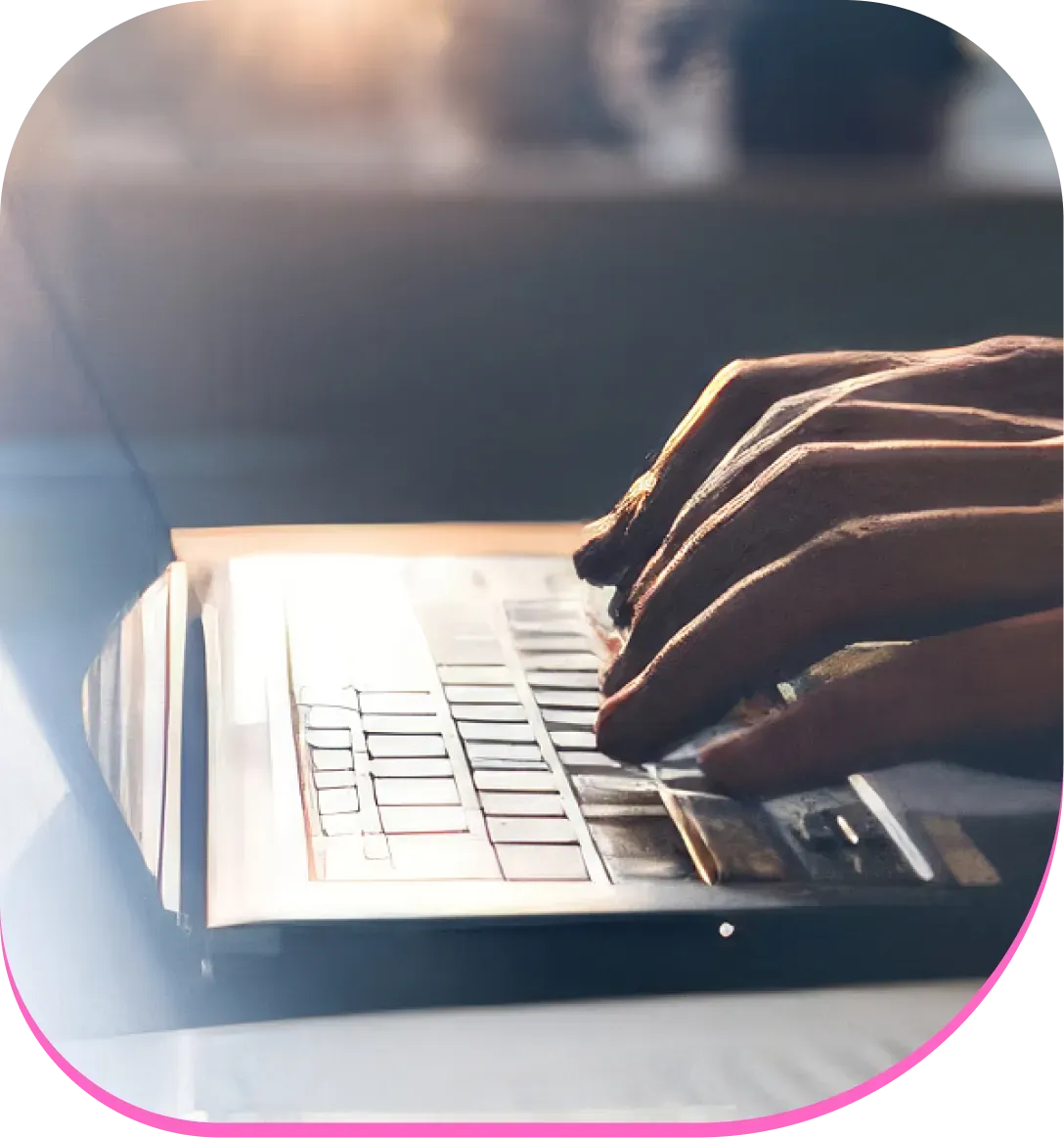 Hands on top of a laptop keyboard