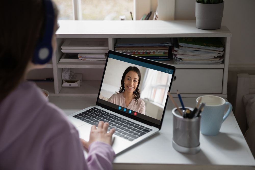 Woman Having An Online Video Call Lesson — Al Roberts Education Centre in Wynnum West, QLD
