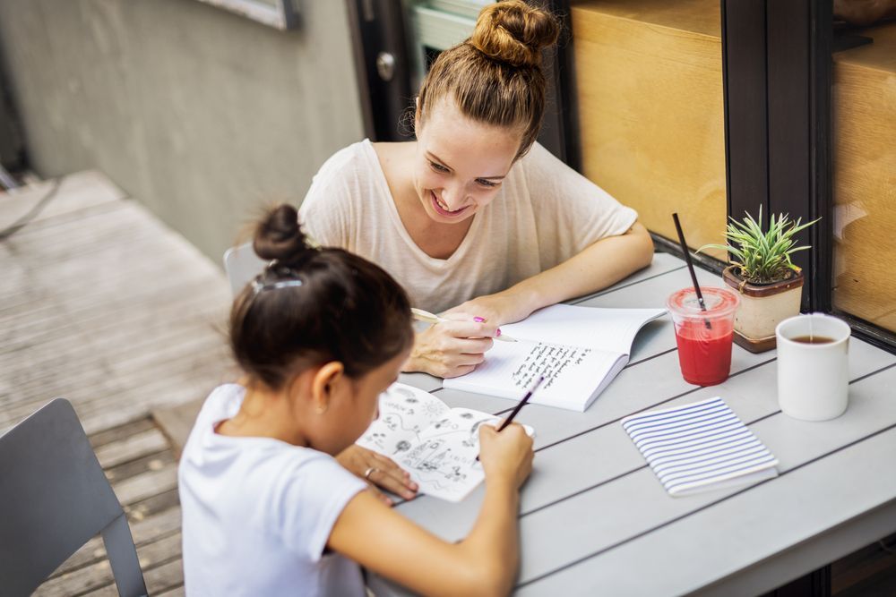 Woman Tutor Teaching Girl Student With Homework — Al Roberts Education Centre in Wynnum West, QLD