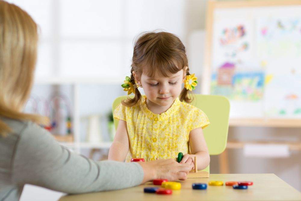 Preschooler Kid Playing With Educational Toys — Al Roberts Education Centre in Wynnum West, QLD