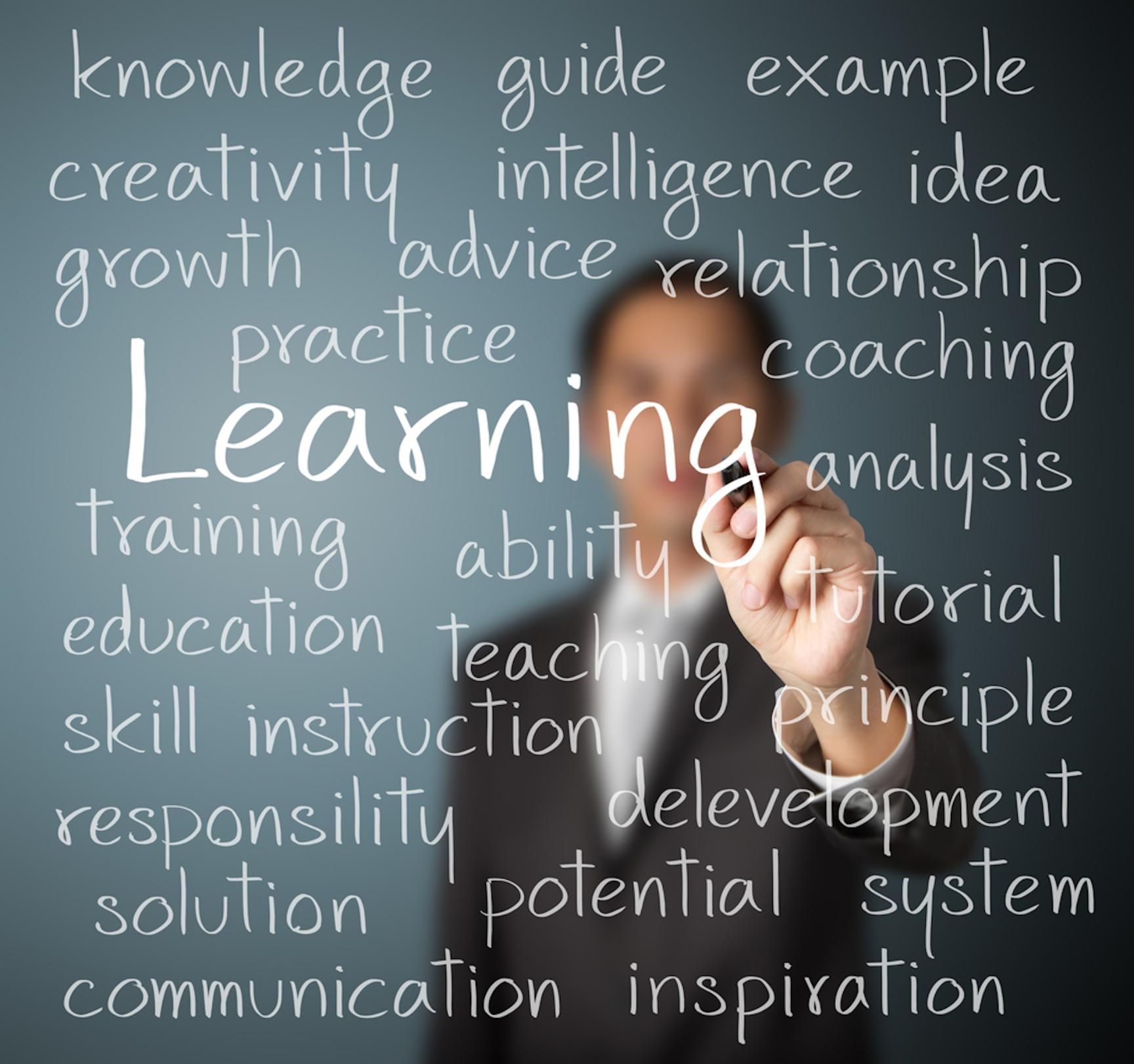 Professional Trainer Writing 'Learning' On Board — Al Roberts Education Centre in Wynnum West, QLD