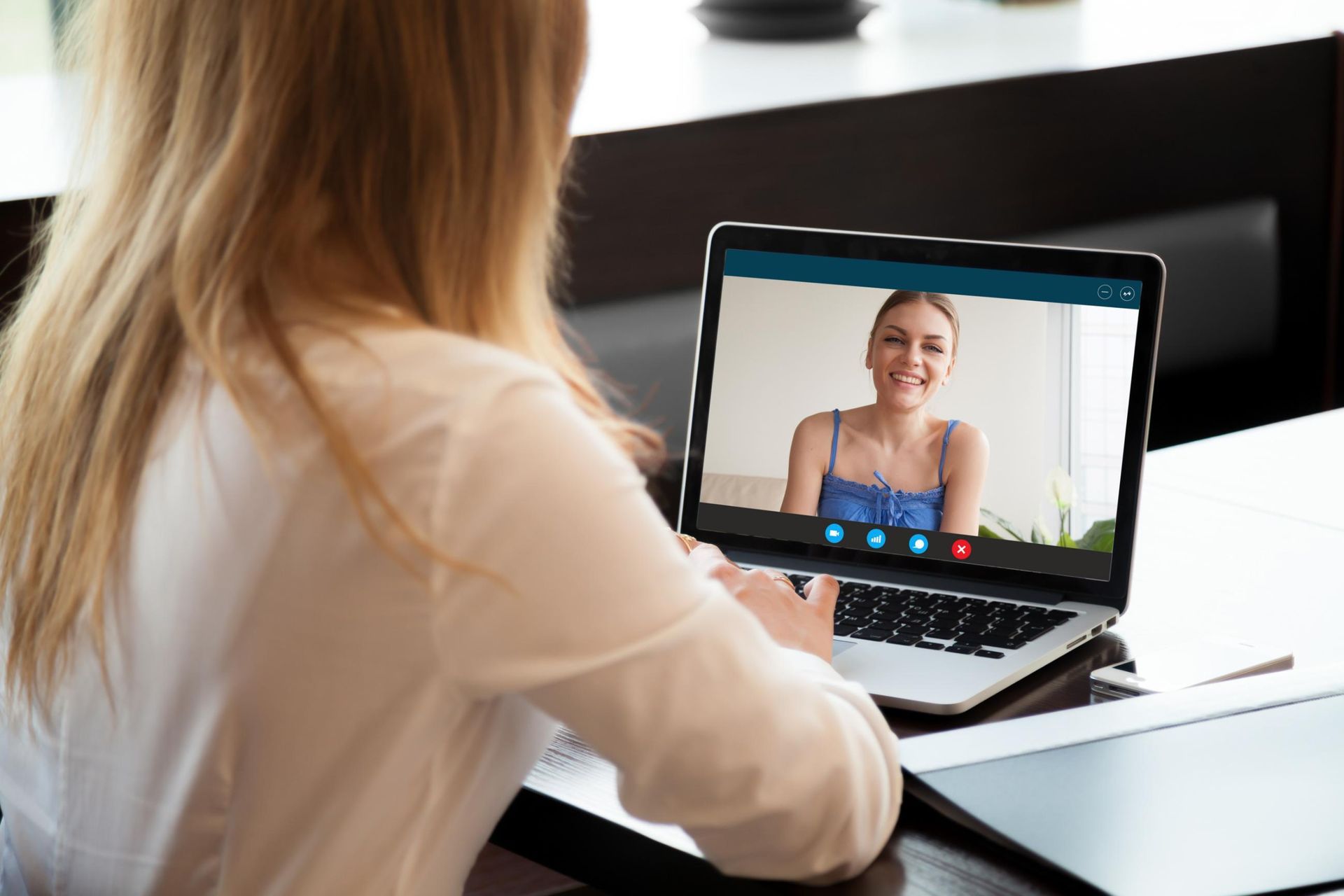 A Woman Is Having a Video Call on Her Laptop — Al Roberts Education Centre in Wynnum West, QLD