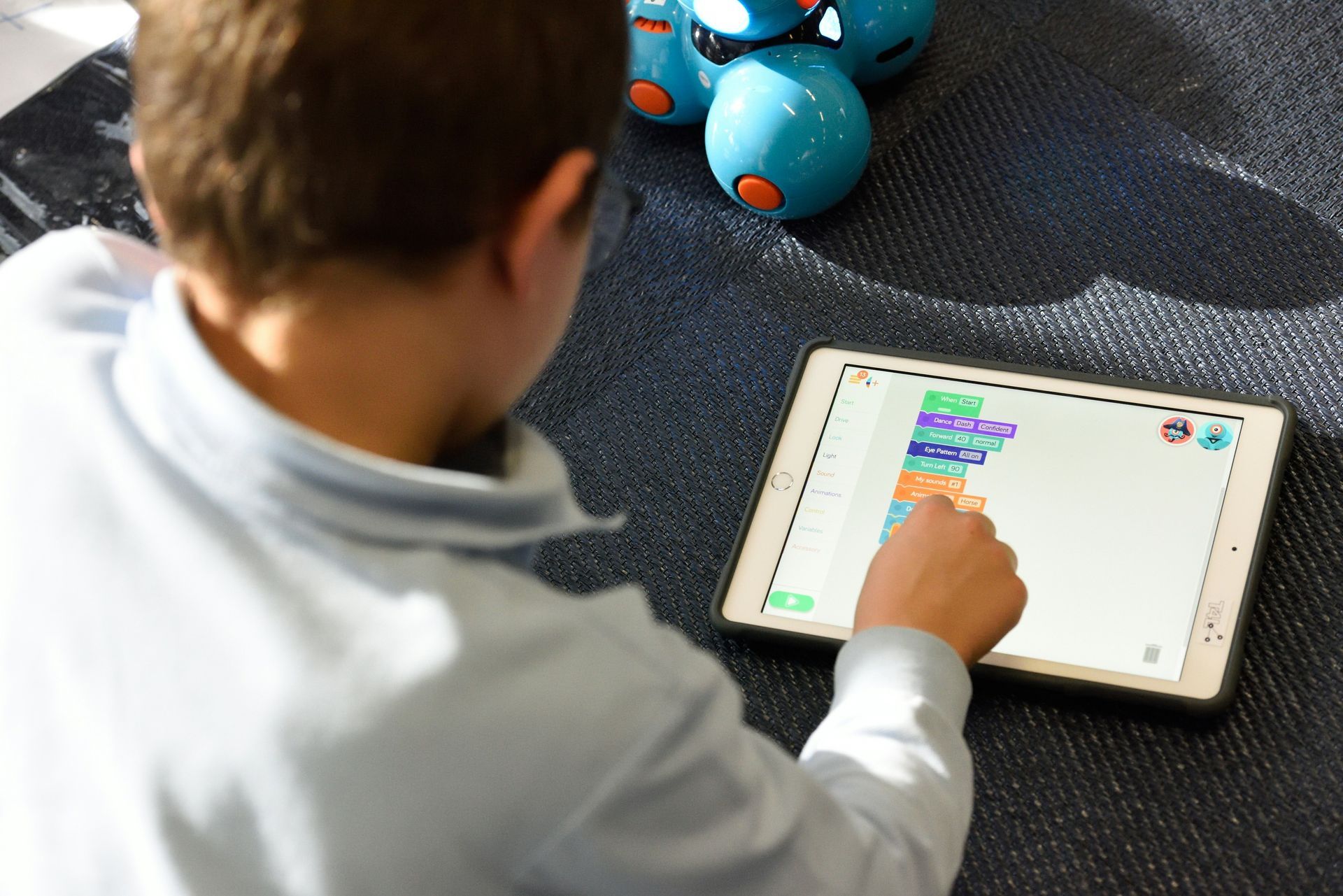 A young boy is learning on a tablet — Al Roberts Education Centre in Wynnum West, QLD