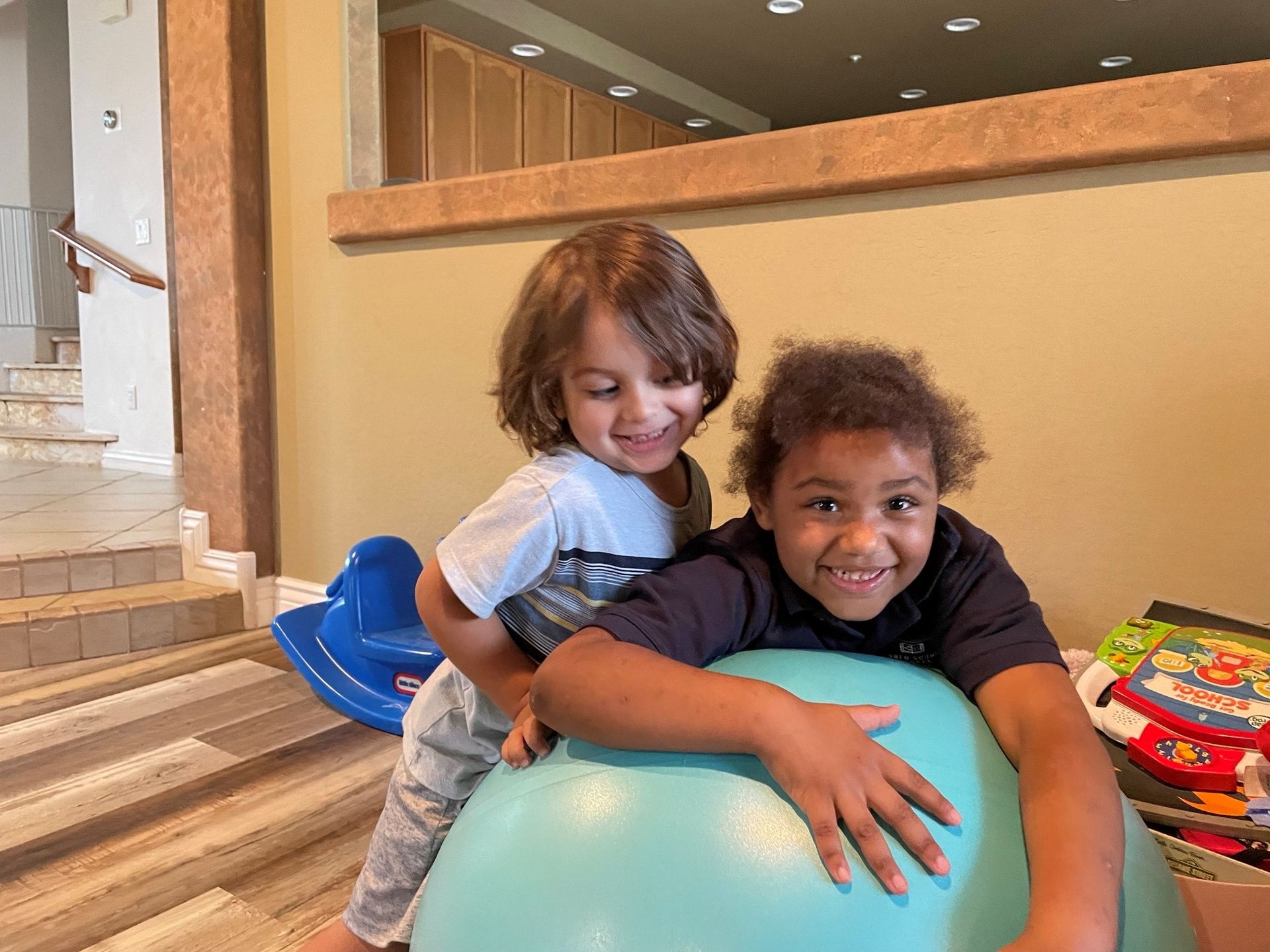 Two Kids Playing Exercise Ball — Goodyear, AZ — Natalie's Fitness Elements Garage