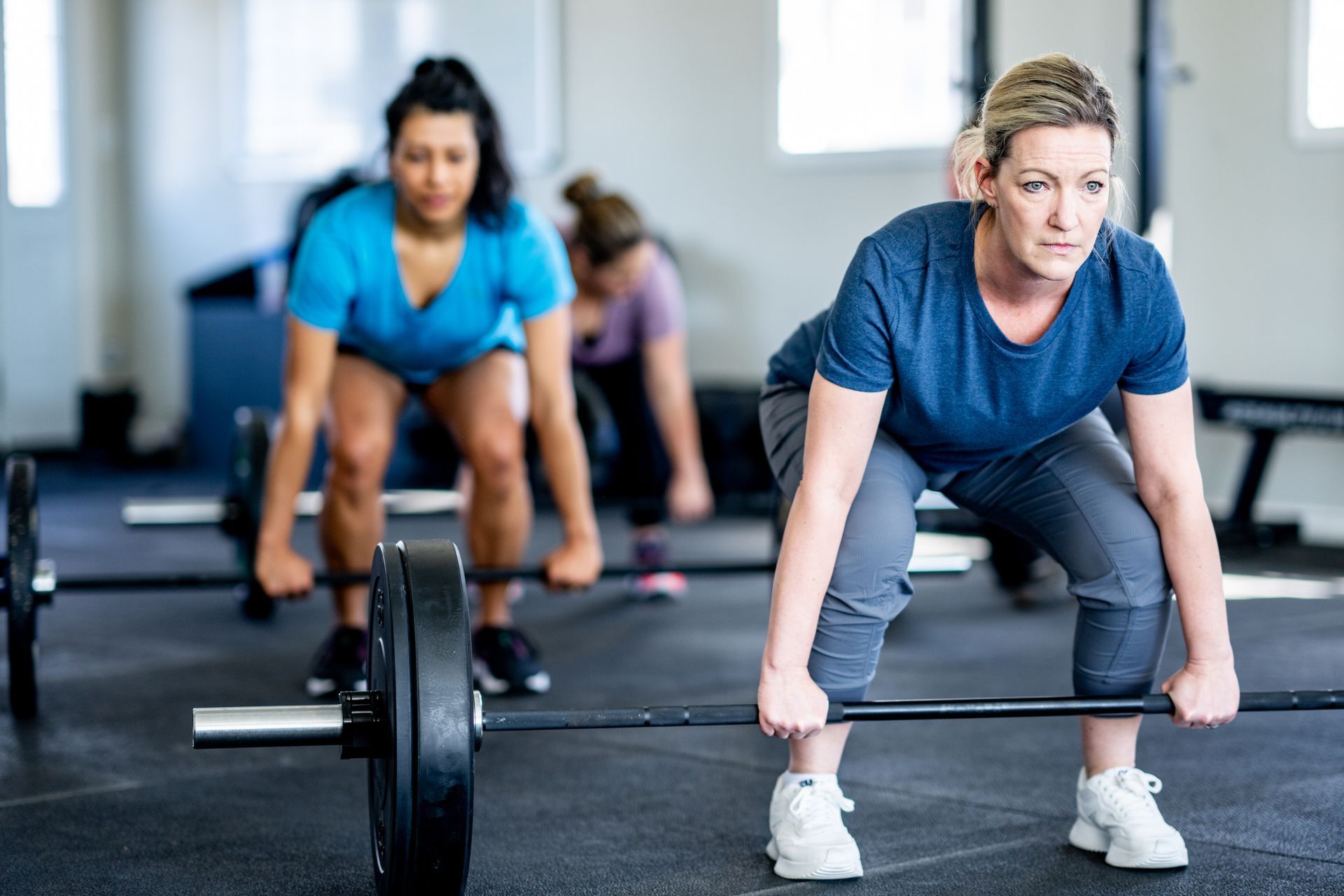 Women Doing Heavy Lift — Goodyear, AZ — Natalie's Fitness Elements Garage Women Doing Heavy Lift — Goodyear, AZ — Natalie's Fitness Elements Garage