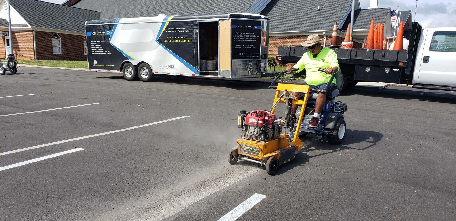 A man in a blue jacket is standing in a parking lot