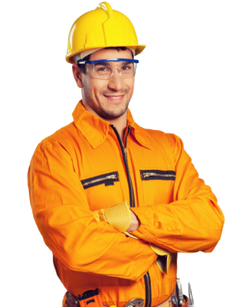 A man wearing a hard hat and goggles stands with his arms crossed