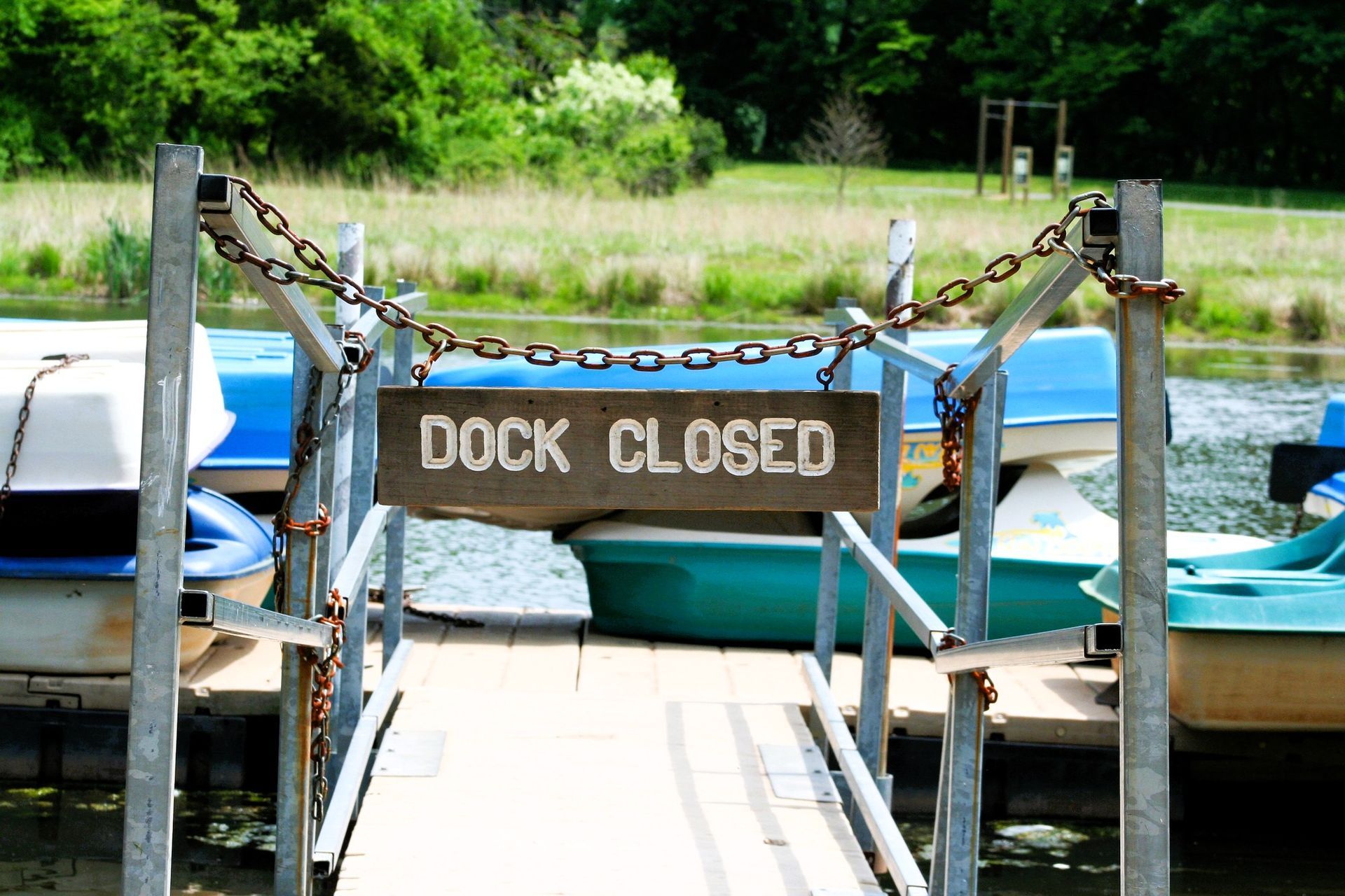Dock Closed sign on a chain, warning of needed dock repair