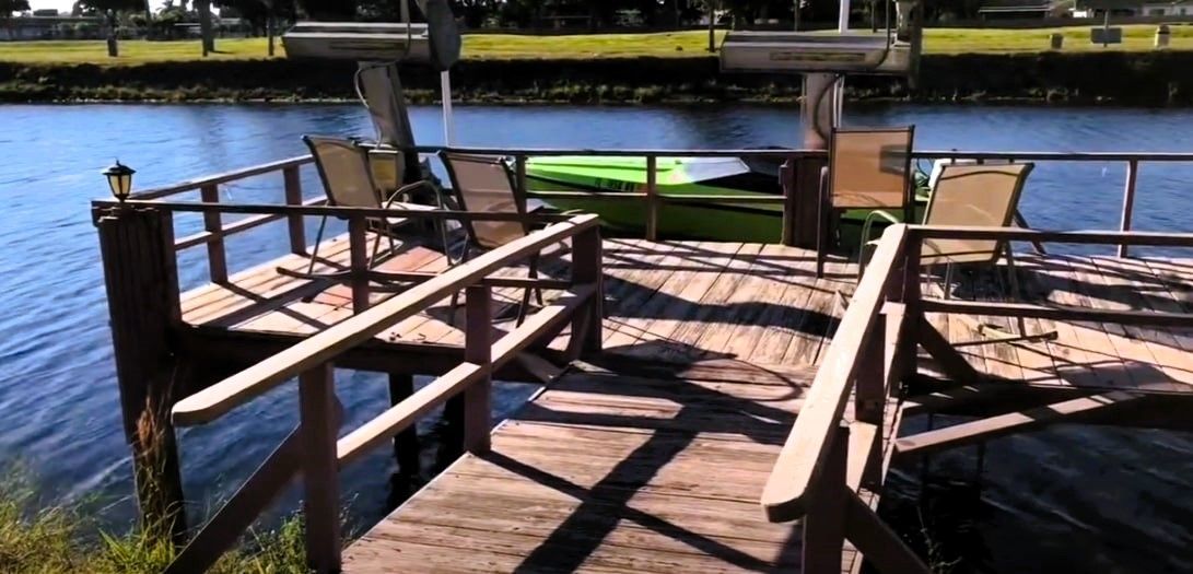Wooden dock in need of repair showing signs of rot and deterioration
