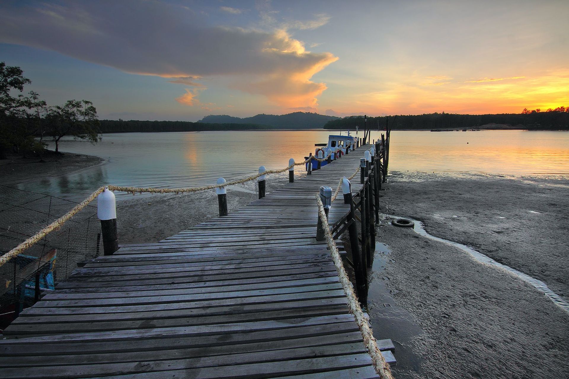 Sunset over a wooden boat dock in Tampa.