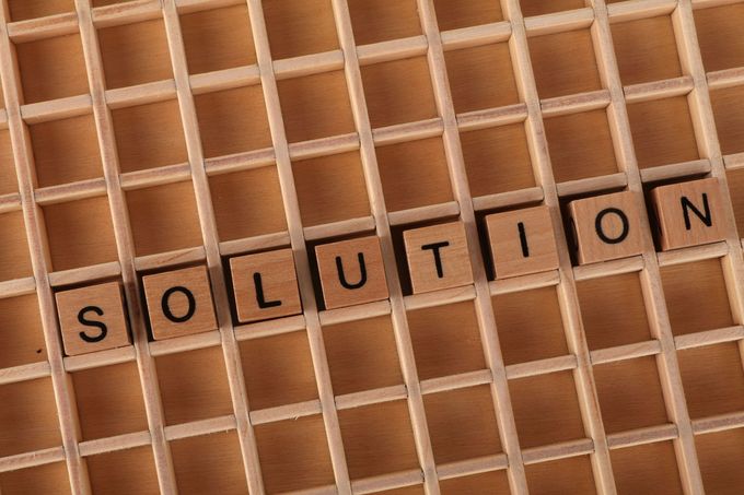 Solutions sign in a board box