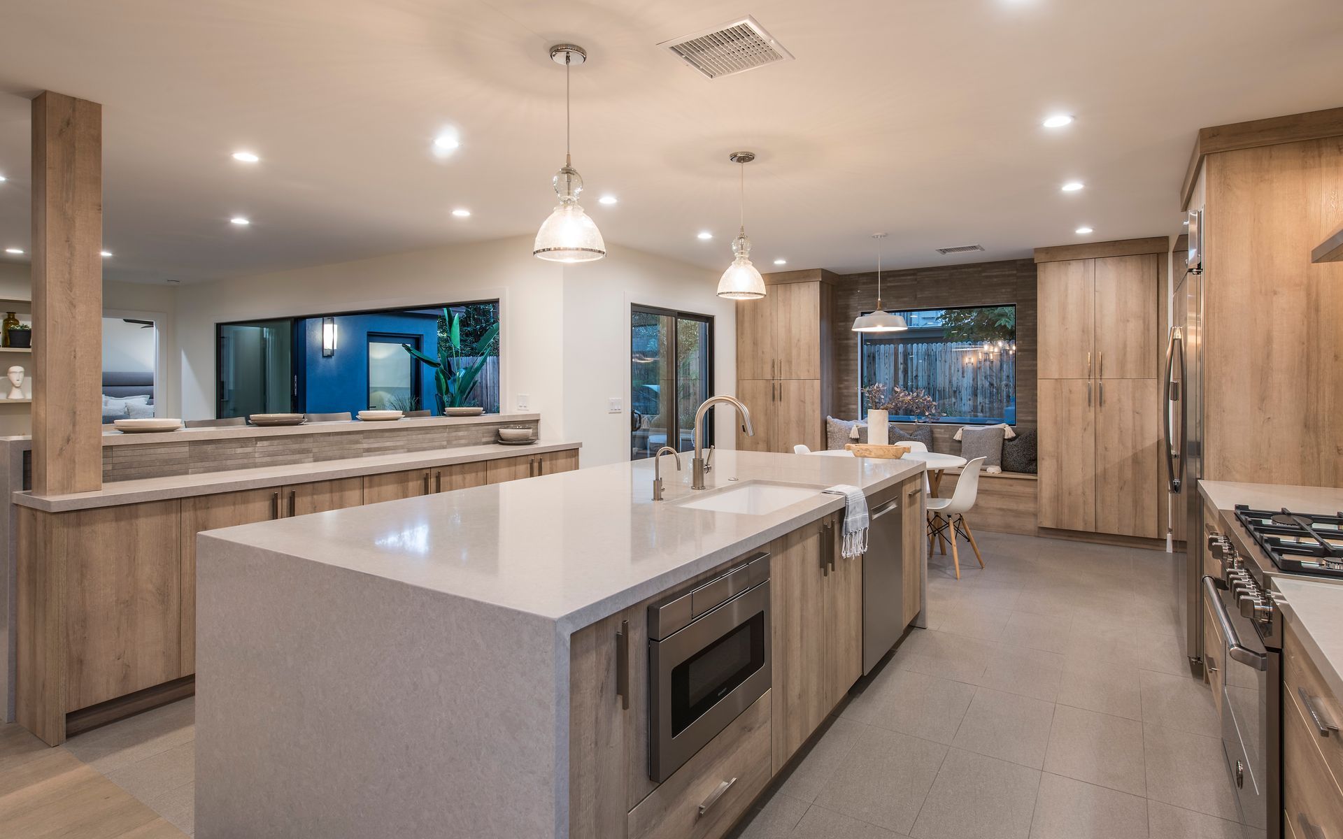 There is a large island in the middle of the kitchen.