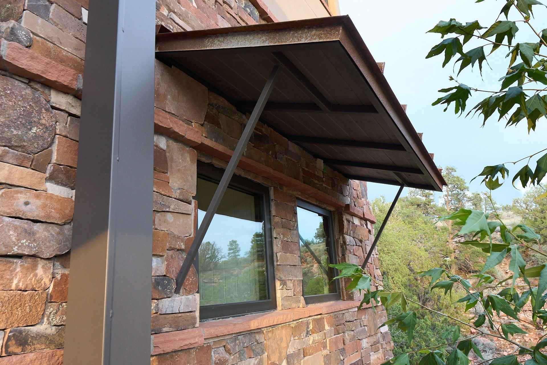 A brick building with a canopy over a window