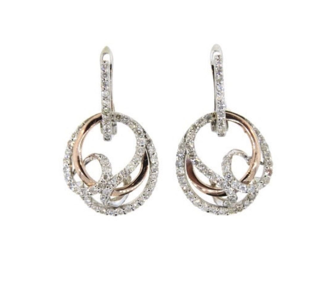 Pair of silver rhinestone drop earrings with teardrop-shaped pendants