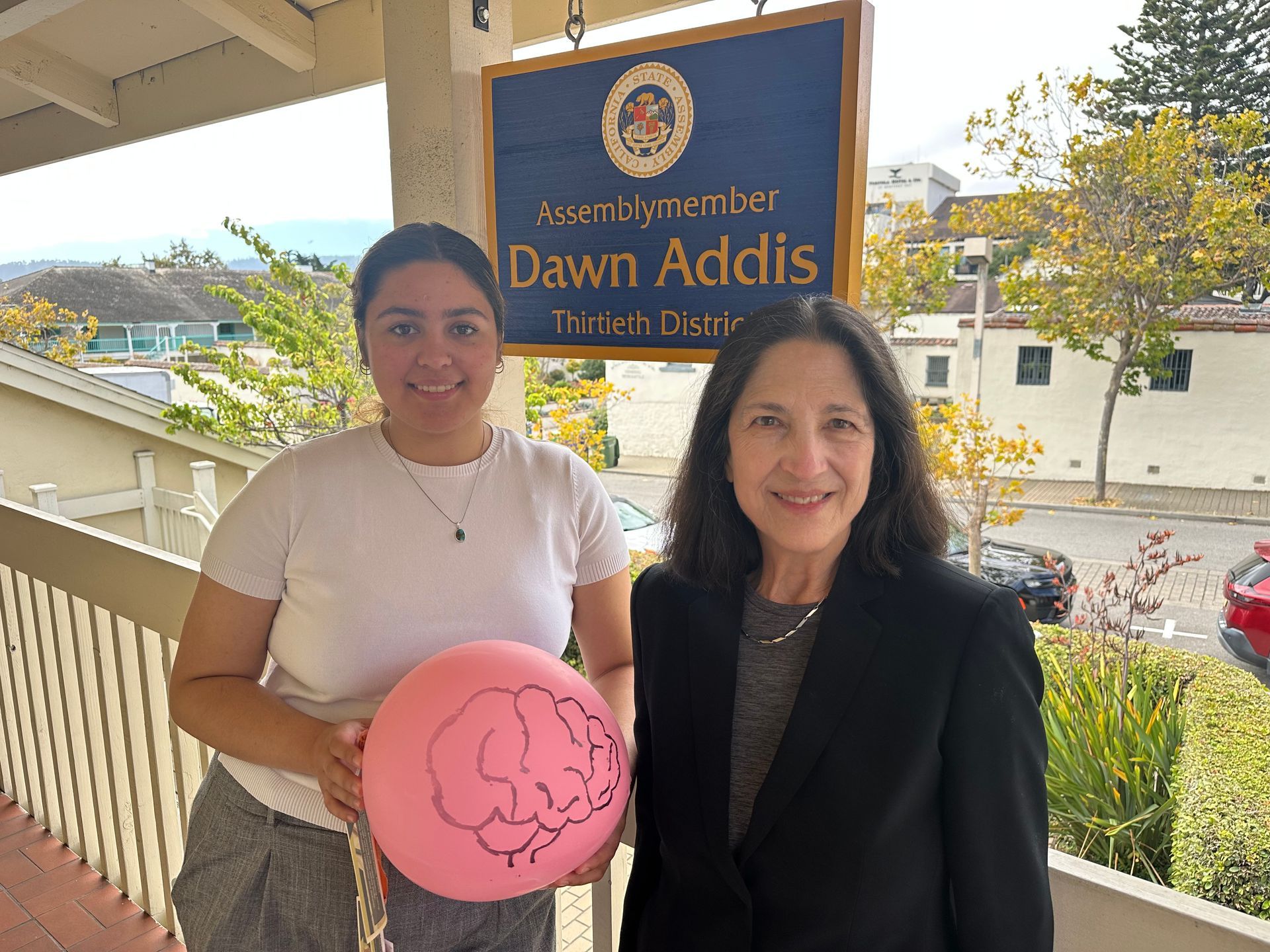 Dr. Stella Legarda meeting Nicole Holguin during a visit to Assemblymember Dawn Addis's office for Balloon Day