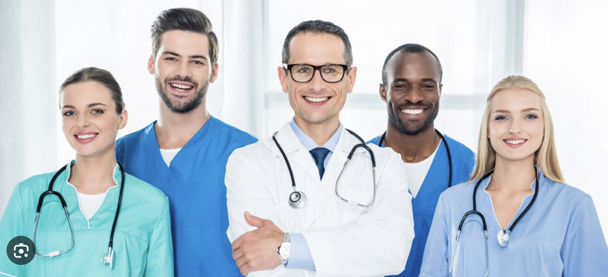 A group of doctors and nurses smiling