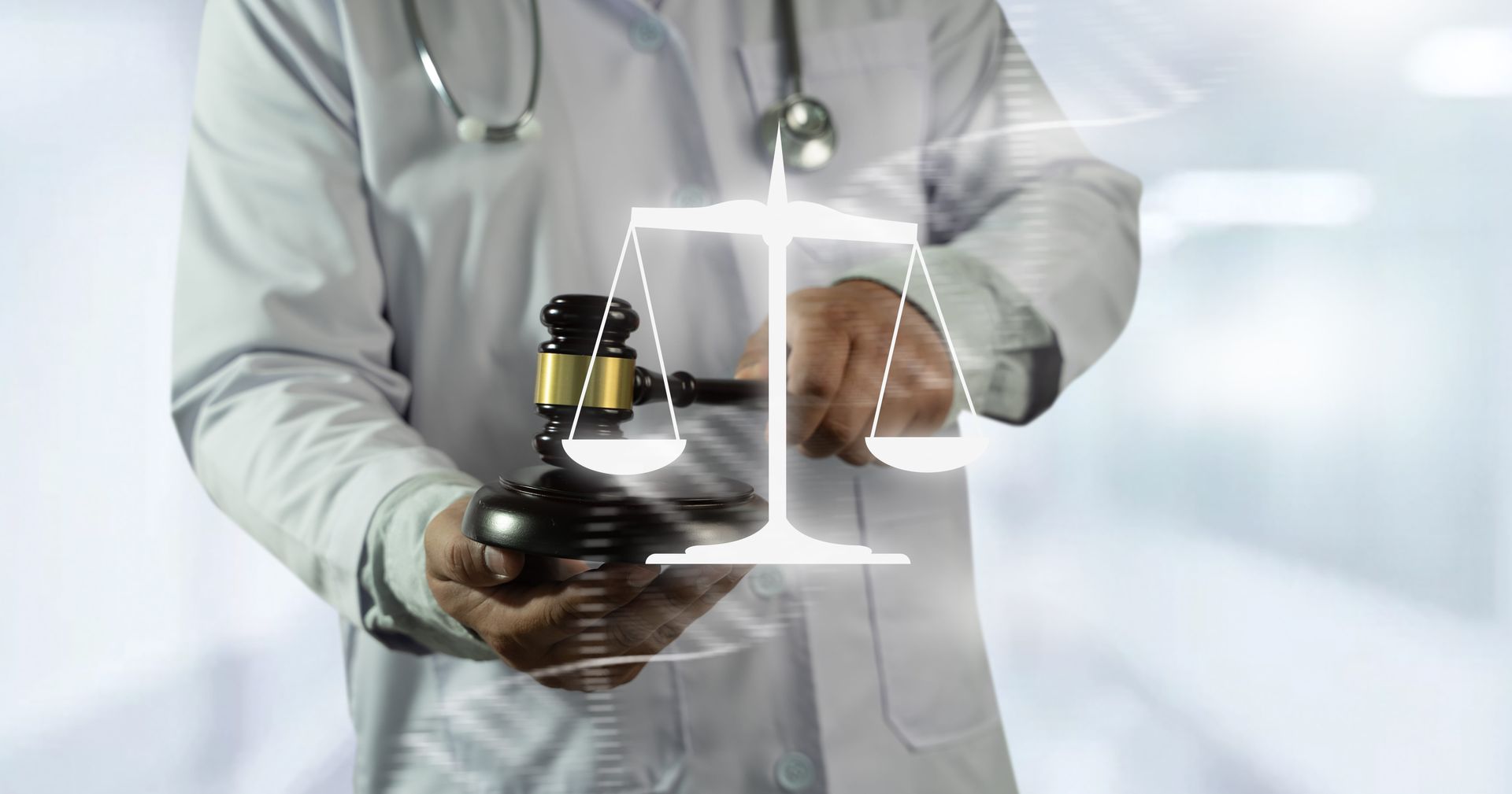Doctor holding a tablet and pointing at a digital interface in a bright hospital corridor
