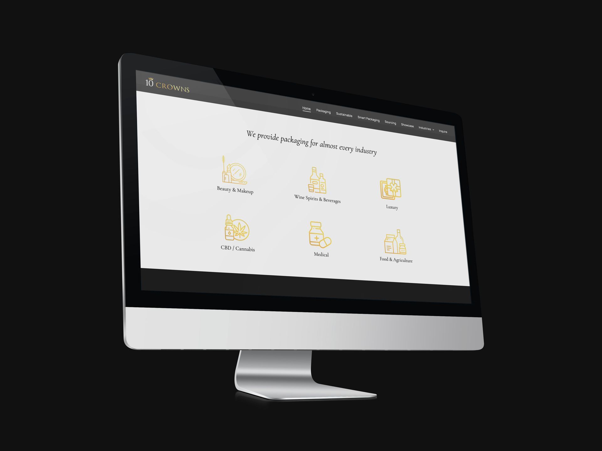 an apple computer with the 10 Crowns website on the screen
