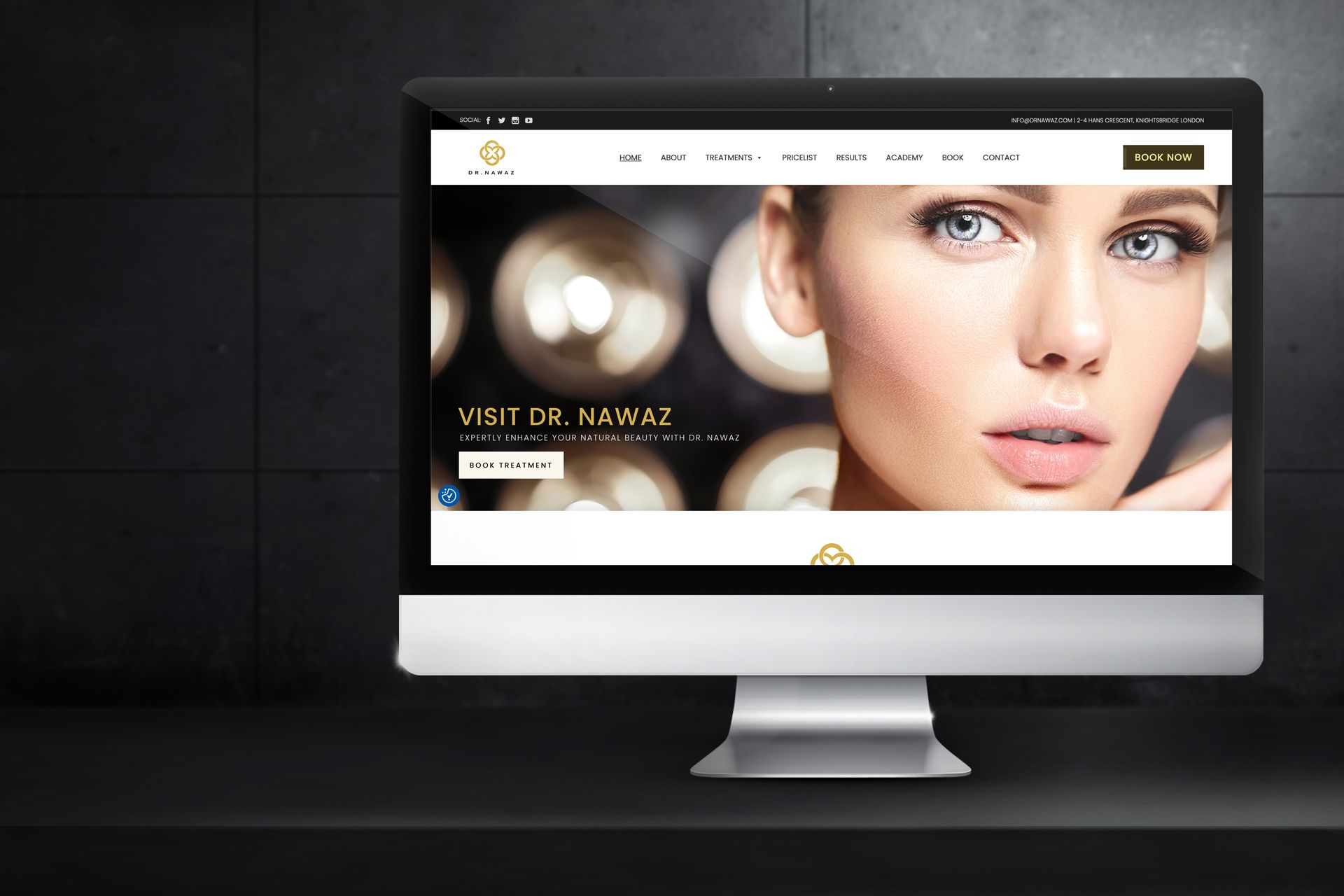 A computer monitor displaying the Dr Nawaz website design by Web mind