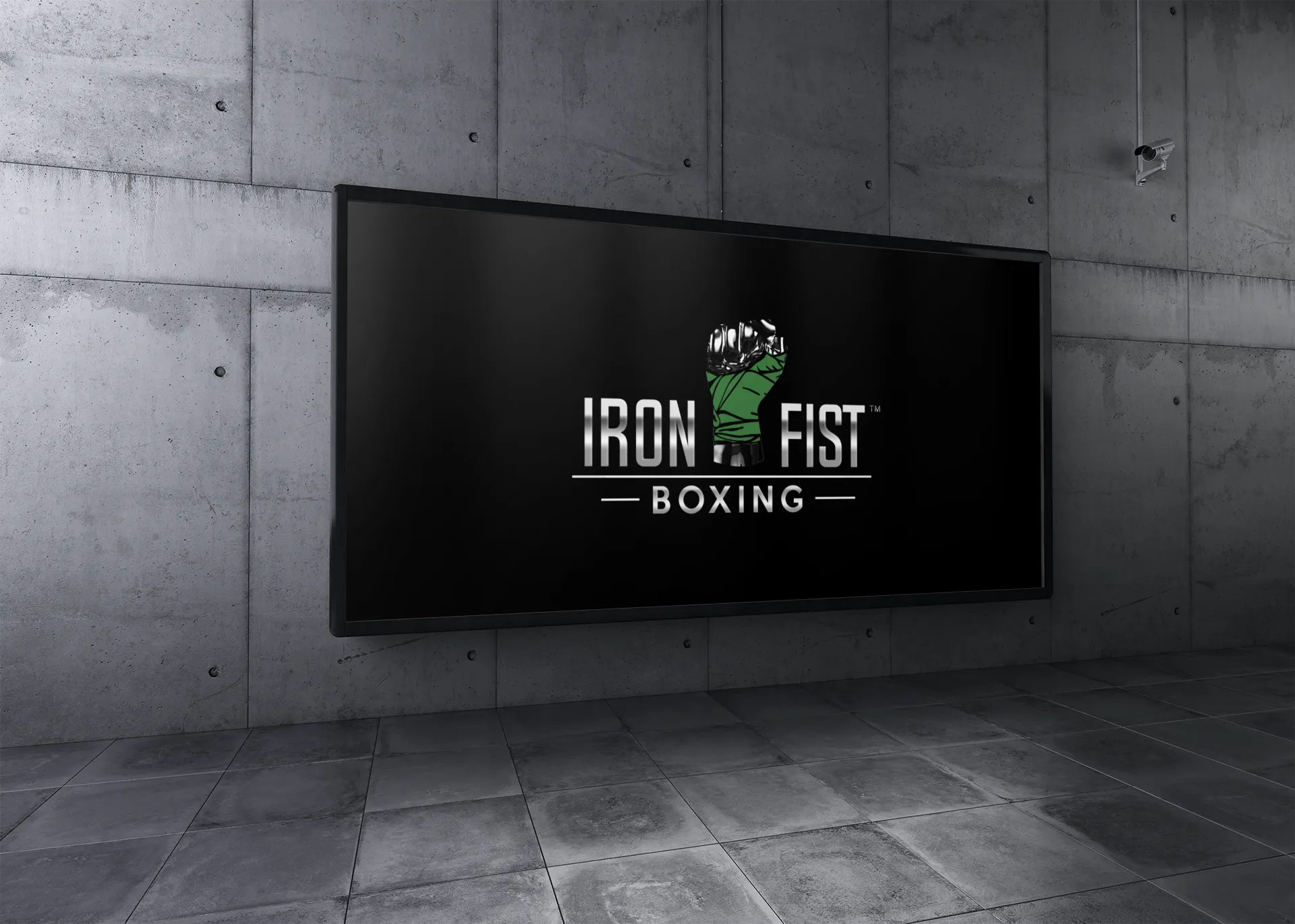 a billboard with iron fist boxing logo on a wall